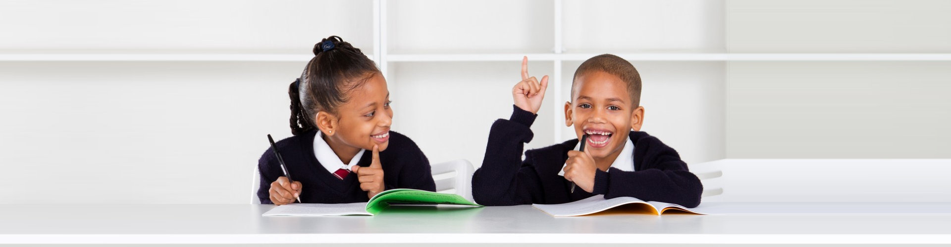image of two kids studying together